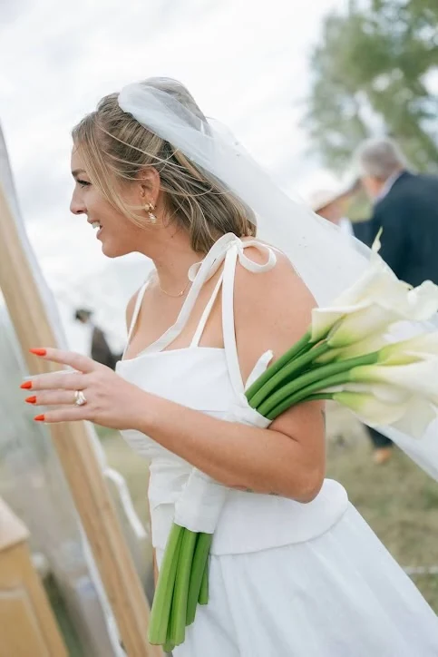 Bride in profile with veil and bouquet