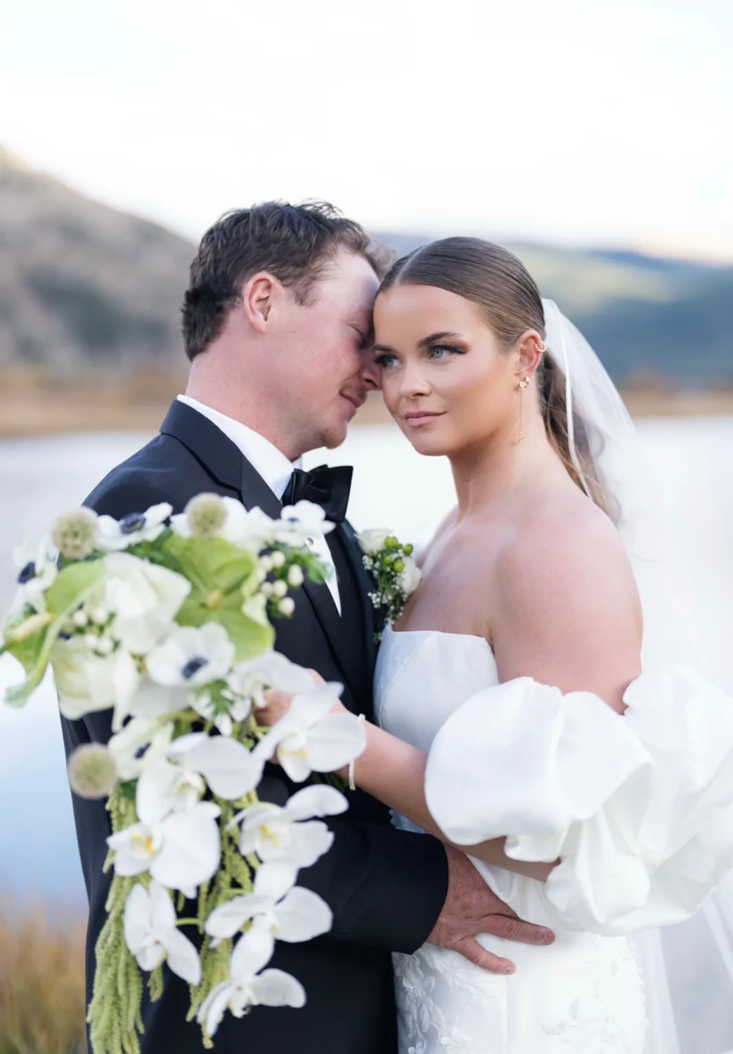 Mountain lake bride and groom