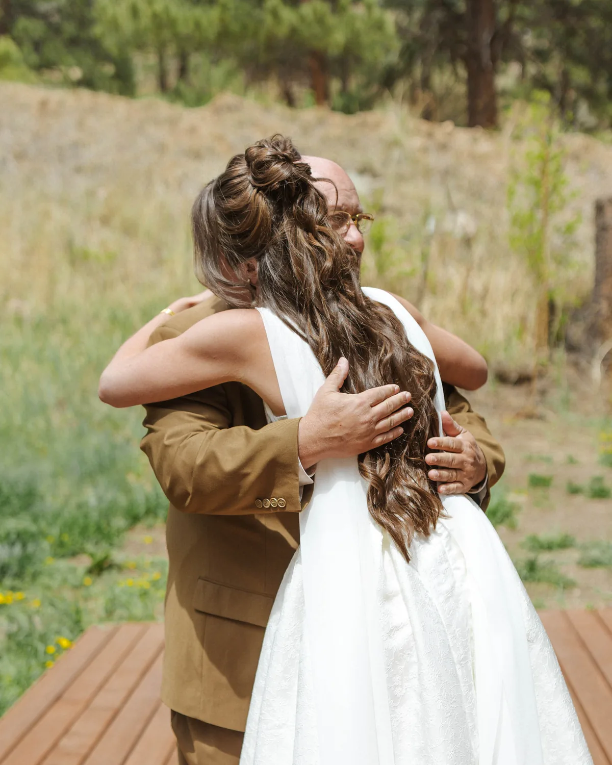 Bride embracing family, braided half-up