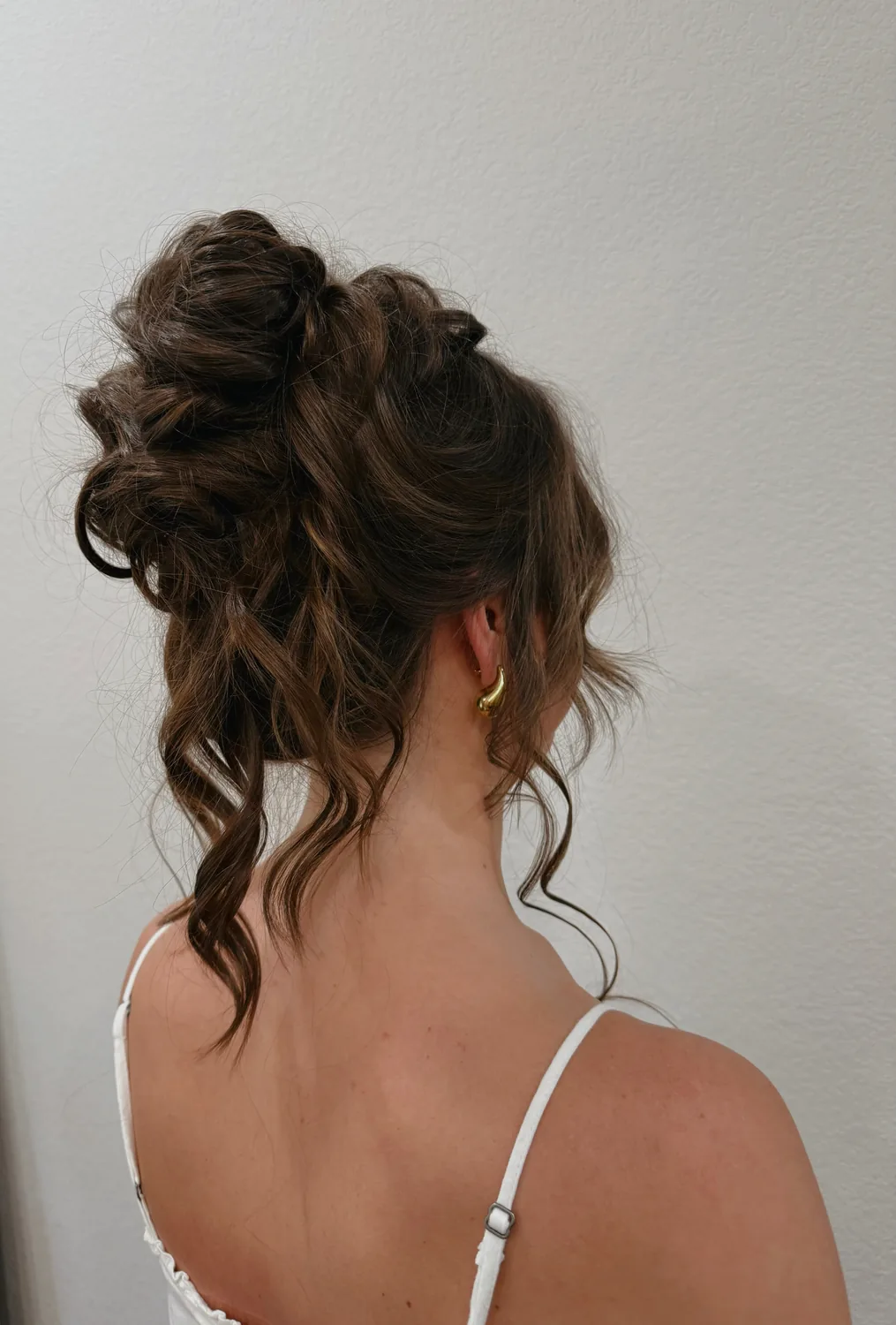 Textured high bun updo